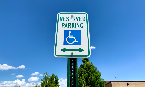 An accessible parking spot sign