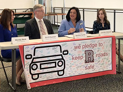 Acting Commissioner Marlene Caride hosts a discussion at Robbinsville High School on distracted driving awareness.