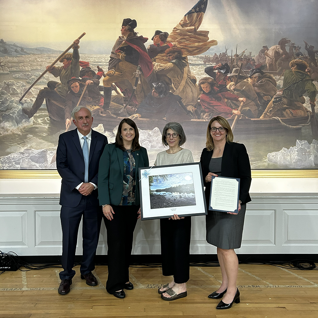 From L: Ken Warren, DRBC General Counsel; Jill Whitcomb, PADEP and current DRBC Chair; Pam Bush, DRBC; and Kristen Bowman Kavanagh, DRBC, pose with the Resolution for the Minutes honoring Pam Bush. Photo by the DRBC.