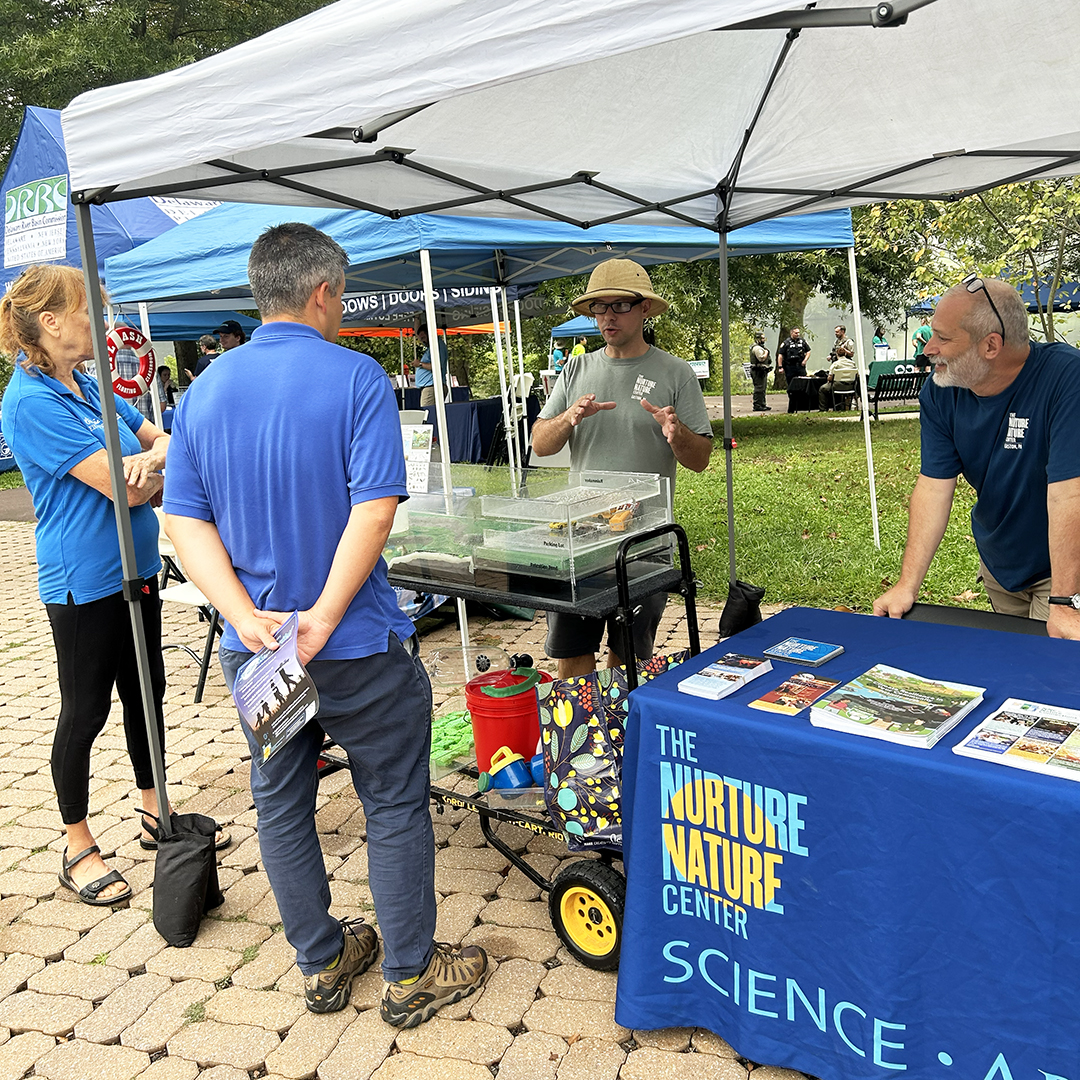 Not only was the Festival a learning opportunity for attendees, it also was for fellow exhibitors! Here, folks from Splash Floating Classroom (far L) & the U.S. Army Corps of Engineers Phila. District chat with folks from the Nurture Nature Center. Photo by the DRBC.