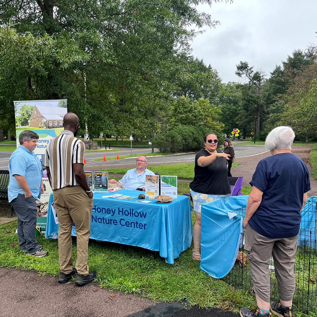 Not only was the Festival a learning opportunity for attendees, it also was for fellow exhibitors! Here, folks from Pa. Fish & Boat Commission (far L), N.J. DEP & the Lewis Fishery chat with folks from the Honey Hollow Nature Center. Photo by the DRBC.