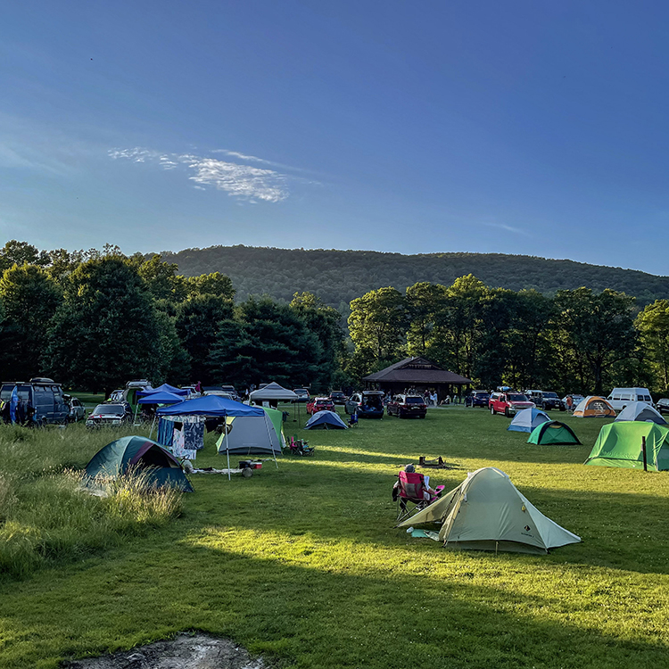 Tents set up in a field. Photo by John Brady.