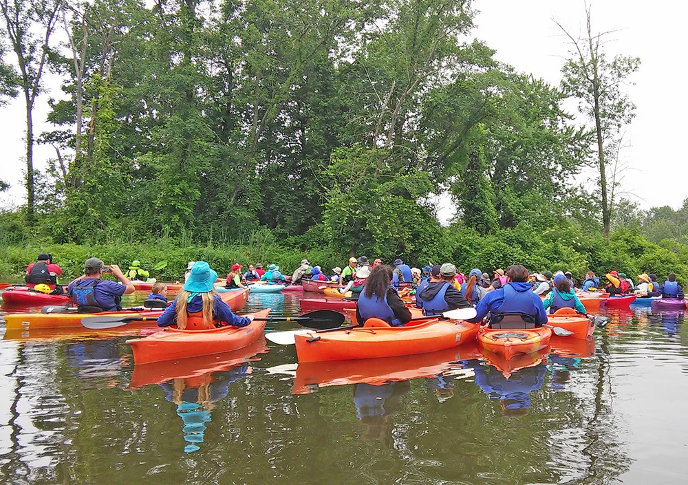 Sojourners "raft up" for a talk while paddling the Crosswicks Creek. Photo by the Delaware River Sojourn.