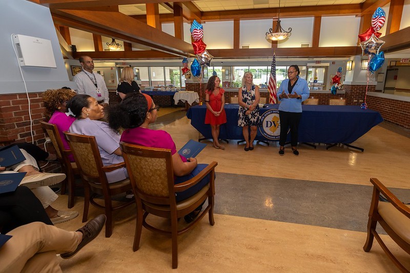 Deputy Commissioner Esther Chucaralao speaks to a group at the event