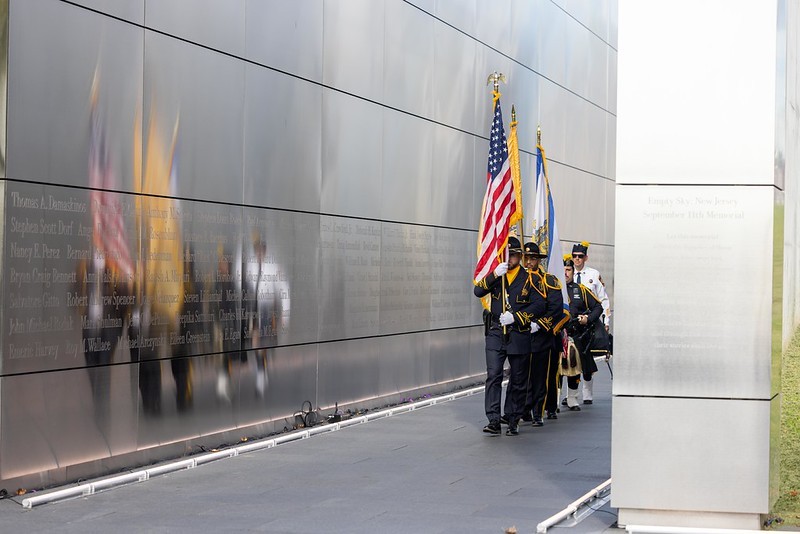 Color guard proceeding past the Empty Sky Memorial