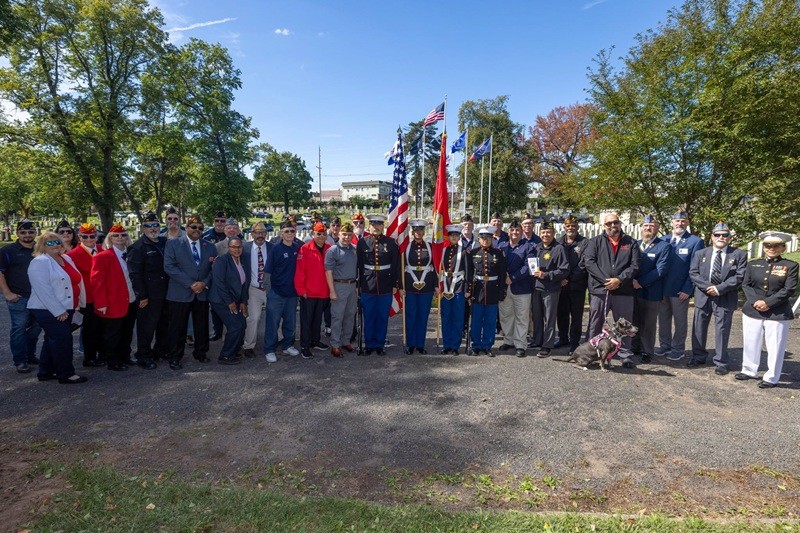 Commissioner Vincent Solomeno, Deputy Commissioner Esther Chucaralao; Doreen Van Bloomer, President of the Hudson County Genealogical Society, and others pose in front of Soldier's Circle at Arlington Cemetery in Kearny.