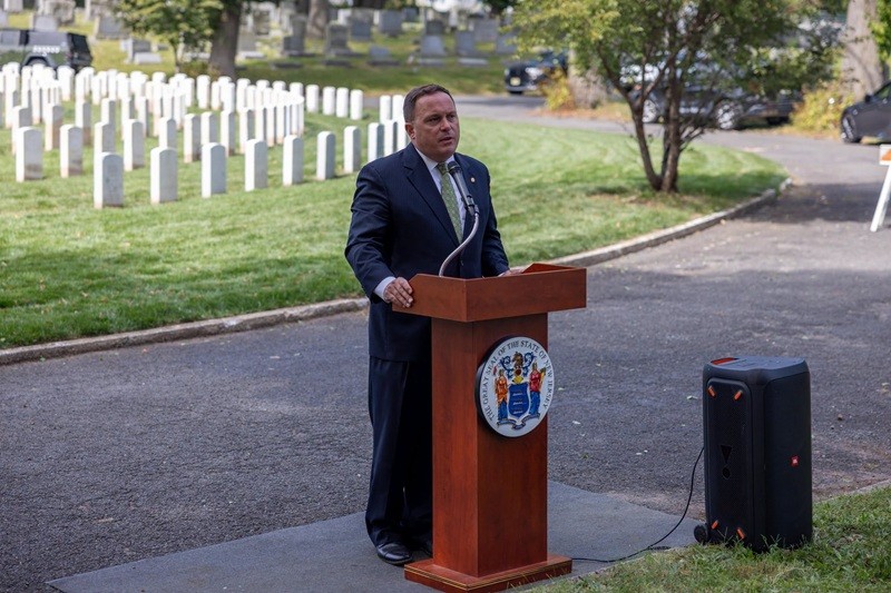 Commissioner Solomeno speaking at the Soldier's Circle rededicated ceremony.