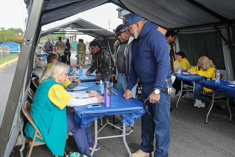 Volunteers talking with Veterans at the 2026 South Jersey Stand Down at the Cherry Hill Armory.