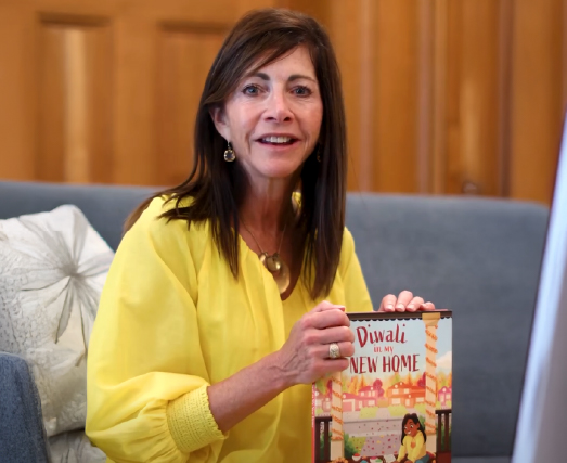 First Lady holding the book