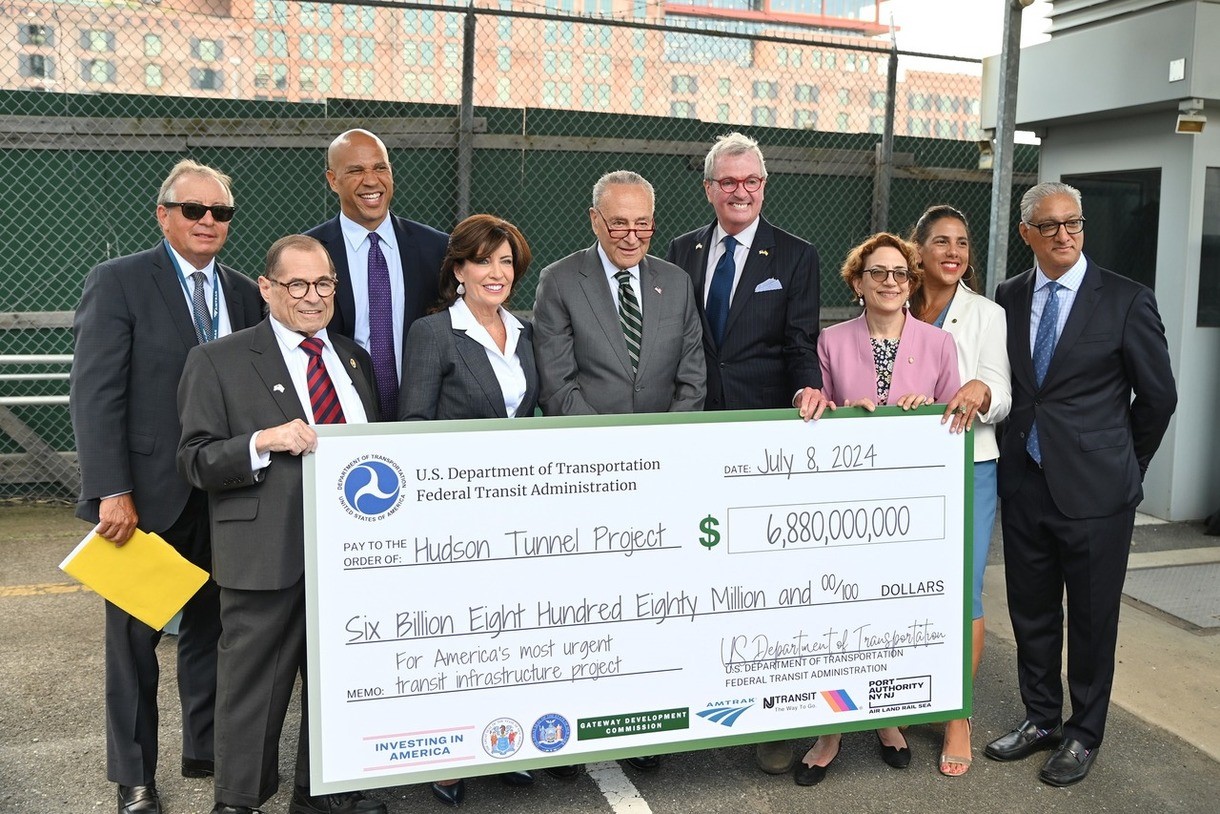 Photo: Governor Murphy and the Gateway Development Commission people are holding a huge check with $6,880,000,000
