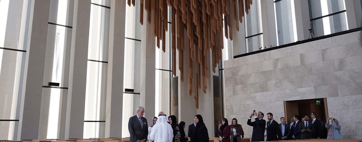 Governor in large room with hanging decorations