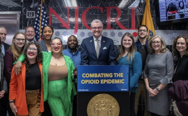 Governor Murphy at the stand with a team after announcing the $130 Million in Opioid Settlement Funding