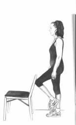 Picture of exercise: woman stands in front of the chair