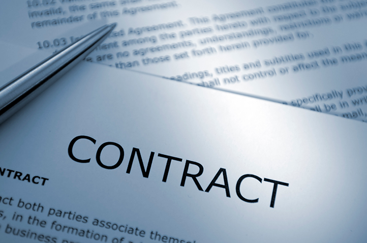 A pen and papers where it says Contract