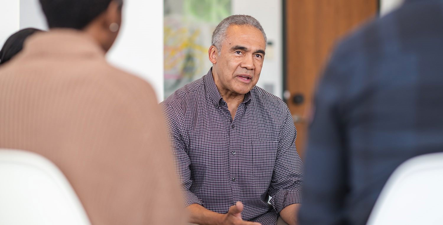 Professional person running a group meeting