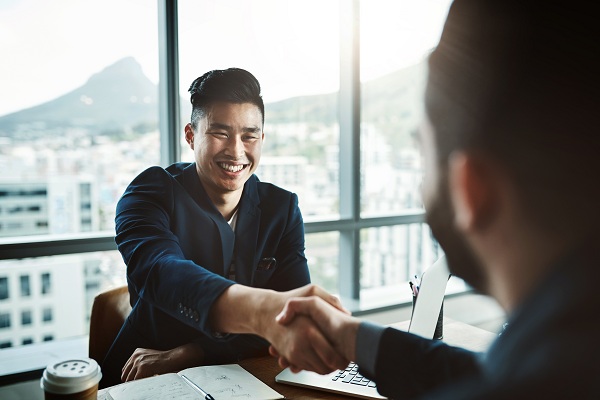 employee shaking hands with employer