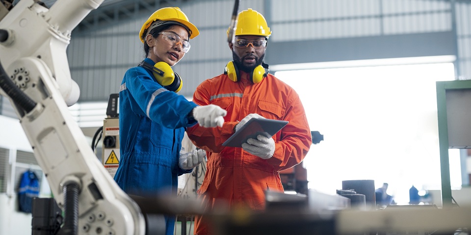worker receiving training at manufacturing facility