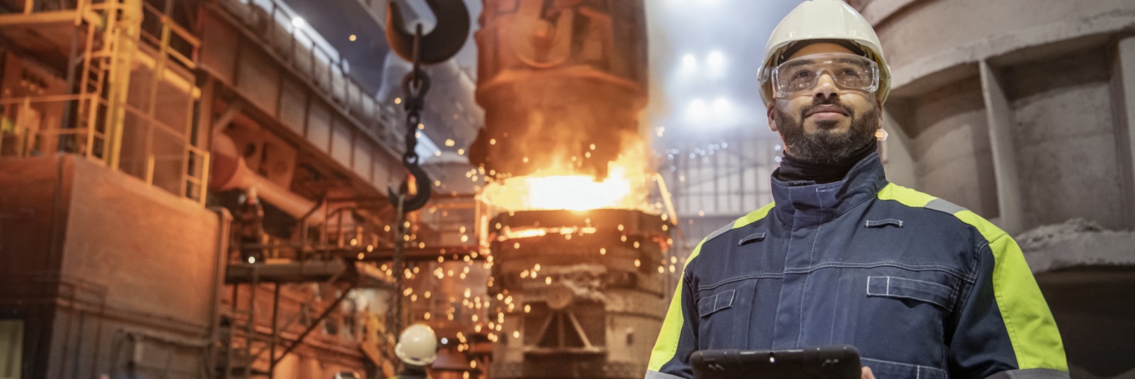 worker with tablet at manufacturing facility