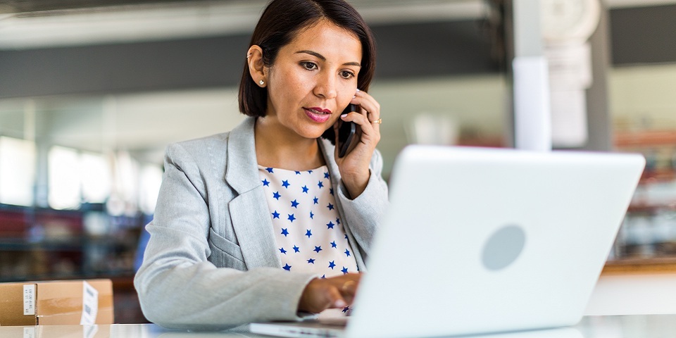 professional of phone at laptop