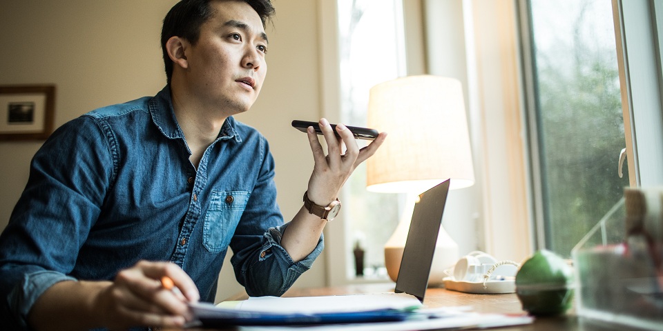Professional on phone at computer