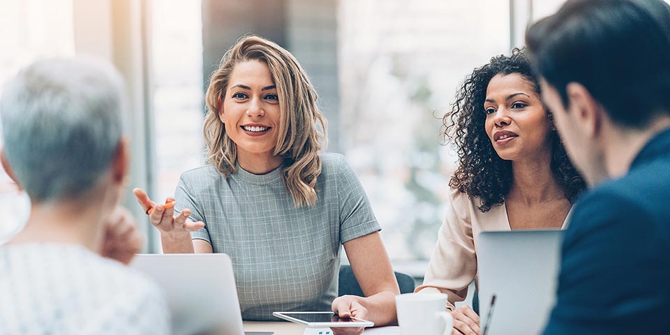 Professionals sitting at table together