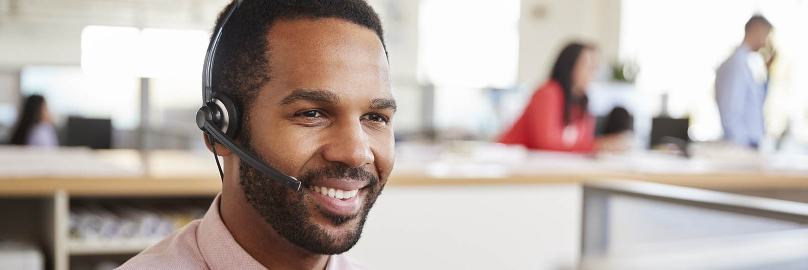 man in call center answering phone calls