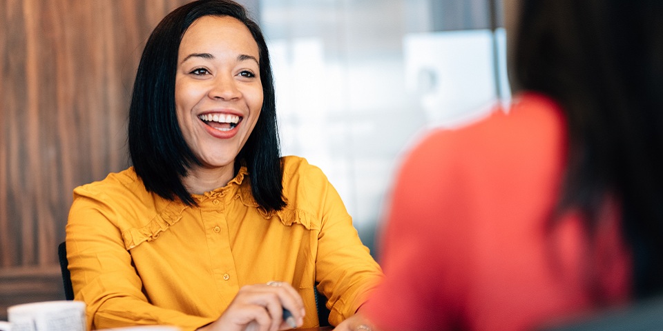 two people talking at an office