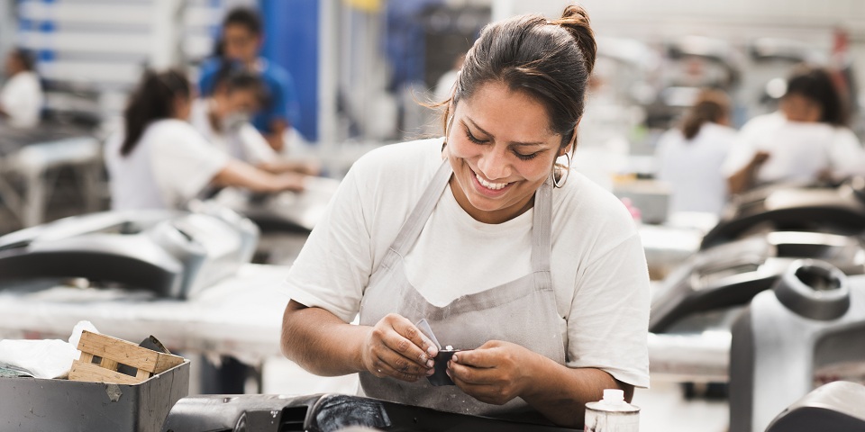 a man loading bakery crates onto a delivery truck
