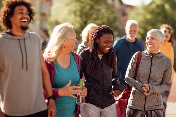 Diverse group of people walking and laughing together