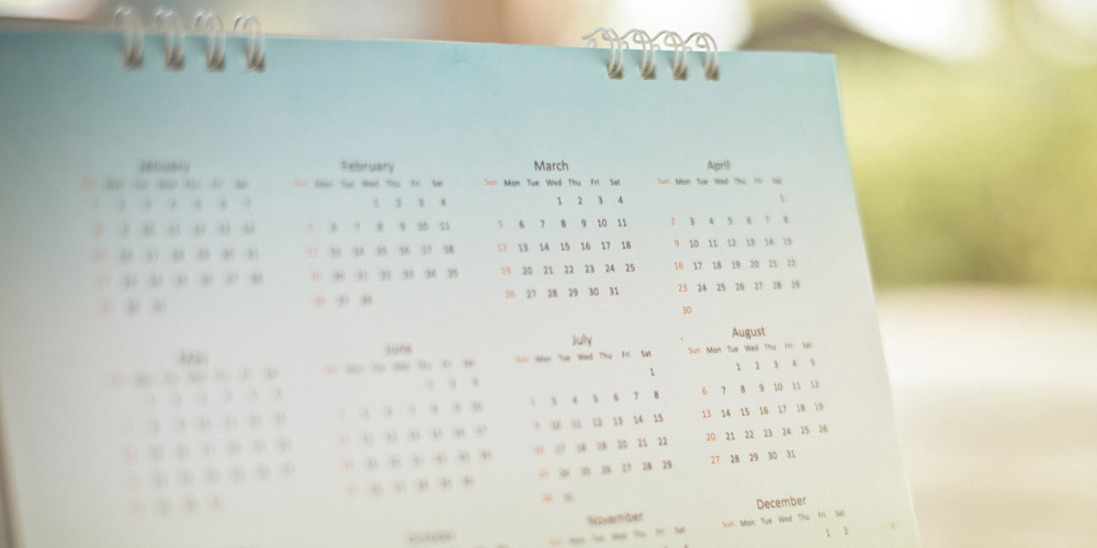 A desktop calendar photographed in soft light