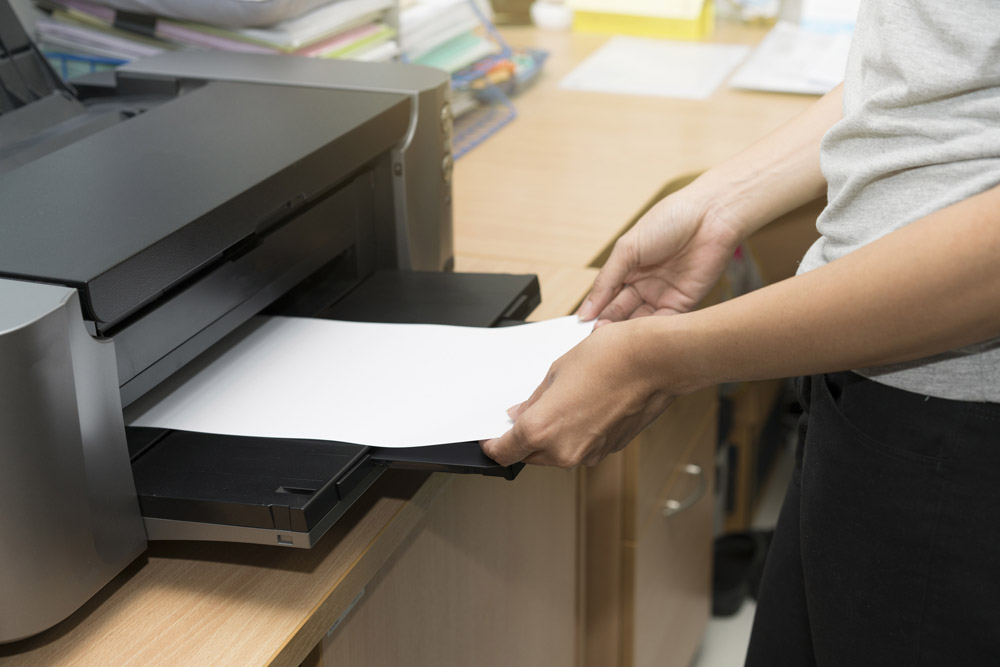 a printer with paper in the tray