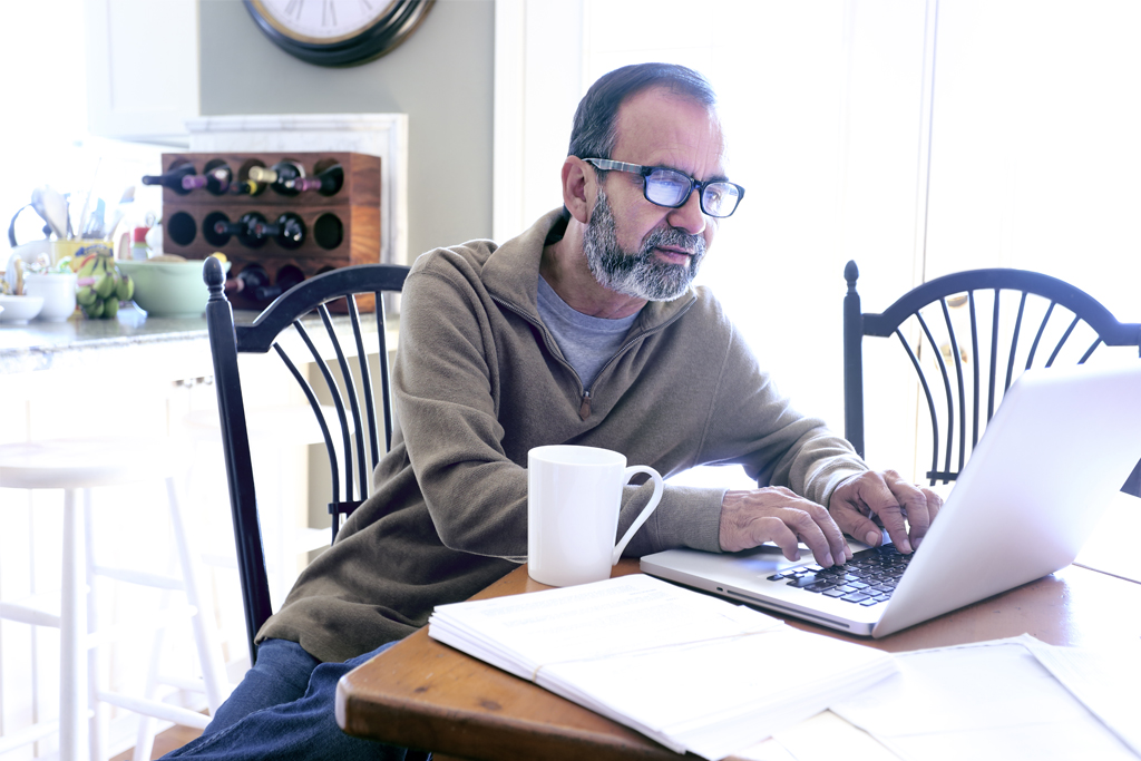 man at his computer