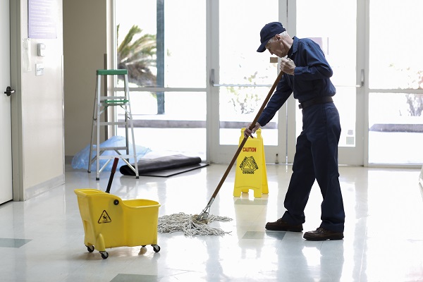 Janitor mopping floor