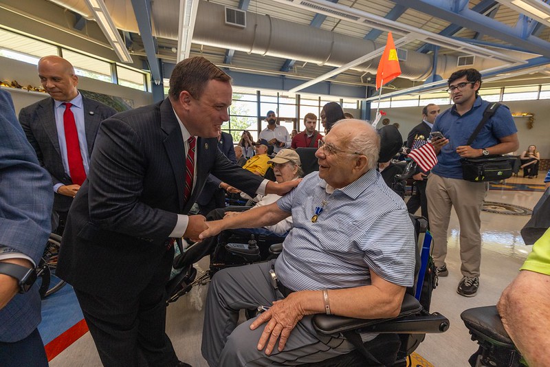 Commissioner Vincent Solomeno with a Veteran State Medal recipient.