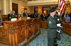 The 150th General Support Aviation Battalion post the colors at the opening of the State Assembly session.