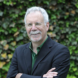 photo of a man with his arms folded