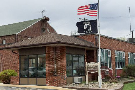 brickk building with american and POW/MIA flag