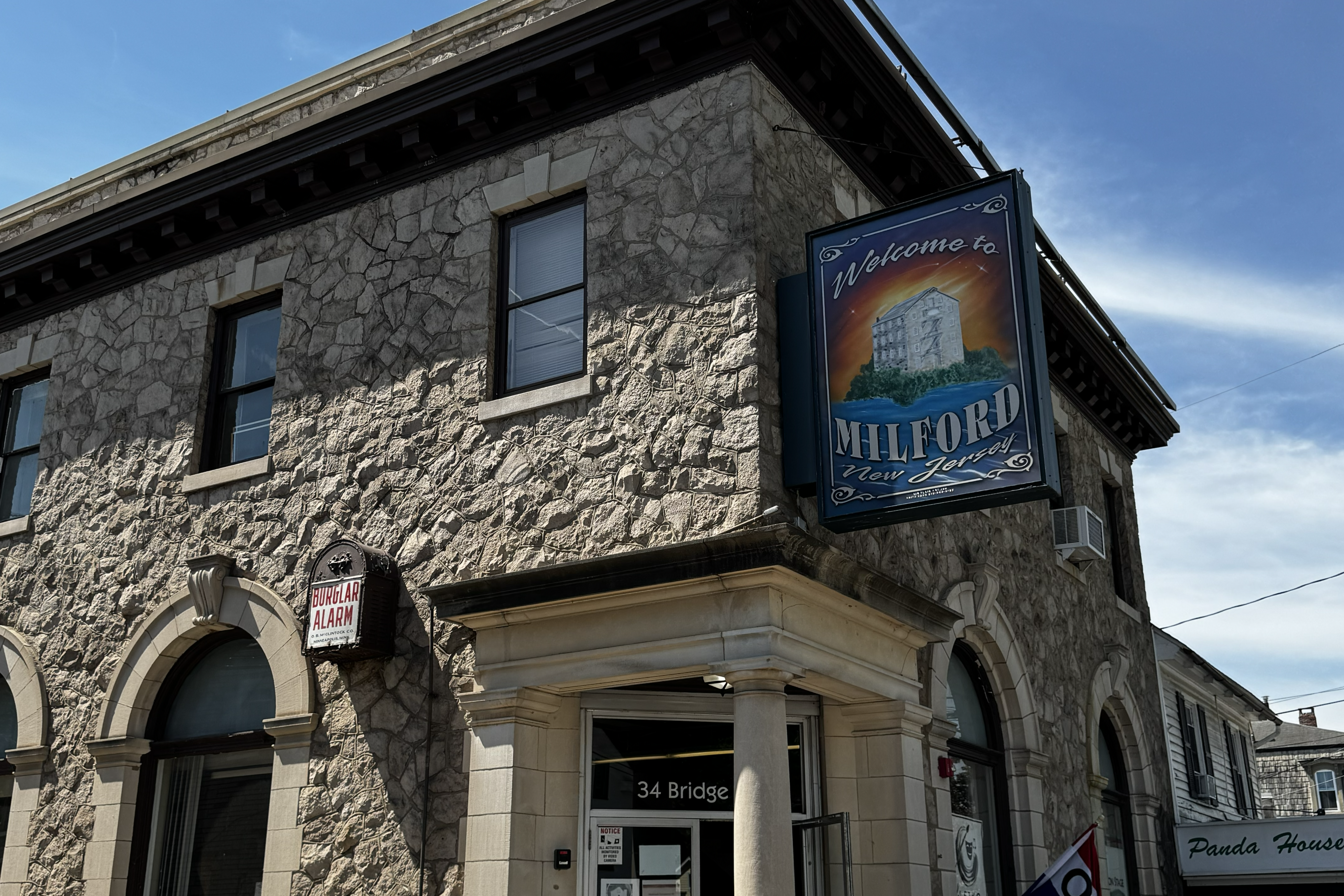 an historic stone building with a sign on it