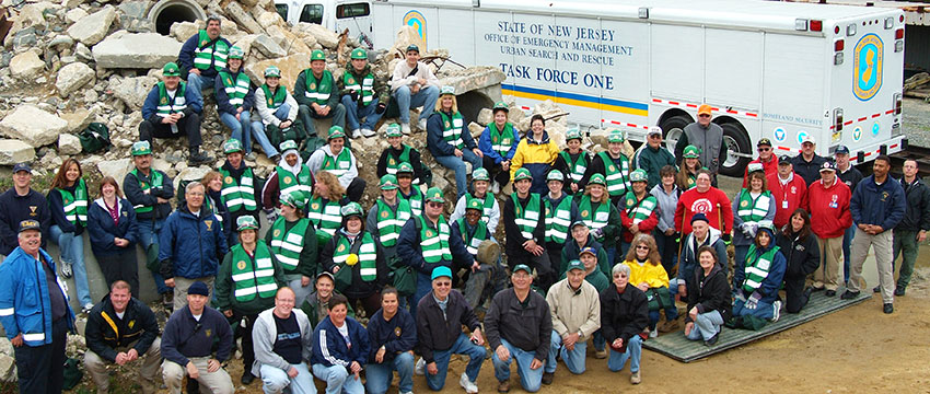 Photo of CERT members in front of truck