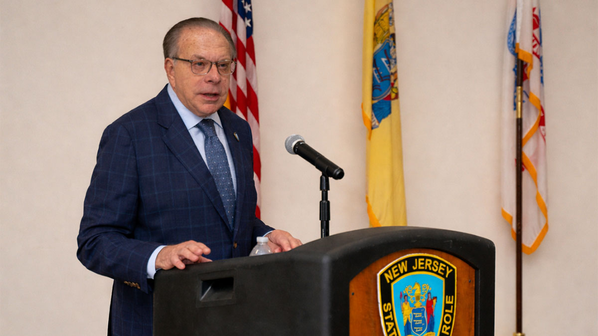 photo: NJ State Parole Board Chairman Samuel J. Plumeri, Jr. behind a podium