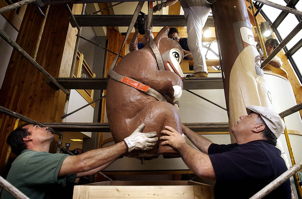 University of Northern Colorado maintenance crew workers guide a 600-pound bear totem pole top into a crate to be shipped back to the Tlingit Nation in Angoon, Alaska, where the totem originally stood and disappeared in 1908. - CreditCreditGlenn Asakawa/The Denver Post, via Getty Images - Link - https://www.state.nj.us/state/njcaia-nytimes-state-of-mourning.shtml