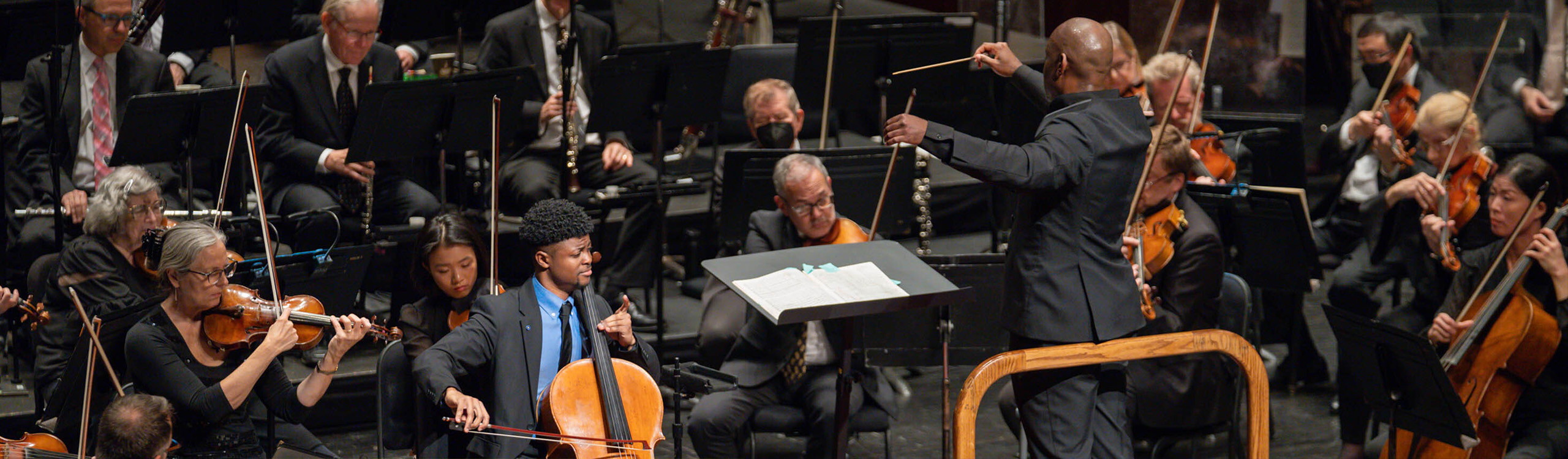 a conductor leads an orchestra