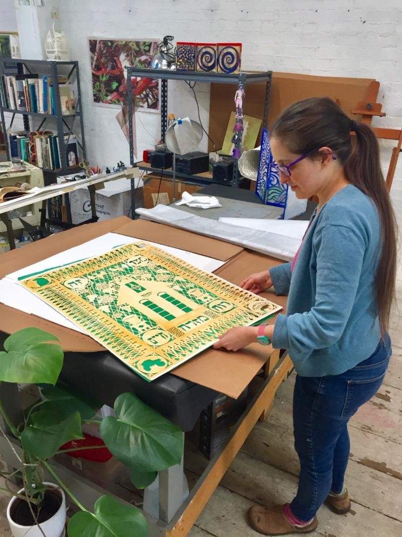 Above: Rachel Asarnow in Deborah Ugoretz's studio showing her traditional Mizrach inspired by a South Jersey Jewish Farm, Dec. 2018