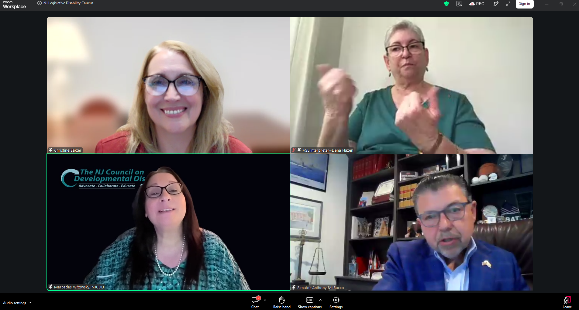 Screenshot of a Zoom meeting titled 'NJ Legislative Disability Caucus' showing four participants in a grid view: Christine Bakter (top left) smiling and wearing glasses; ASL interpreter Dena Hazen (top right) actively signing in a teal top; Mercedes Witowsky from NJCDD (bottom left) with The NJ Council on Developmental Disabilities logo visible behind her; and Senator Anthony M. Bucco (bottom right) in a blue shirt with bookshelves in the background.